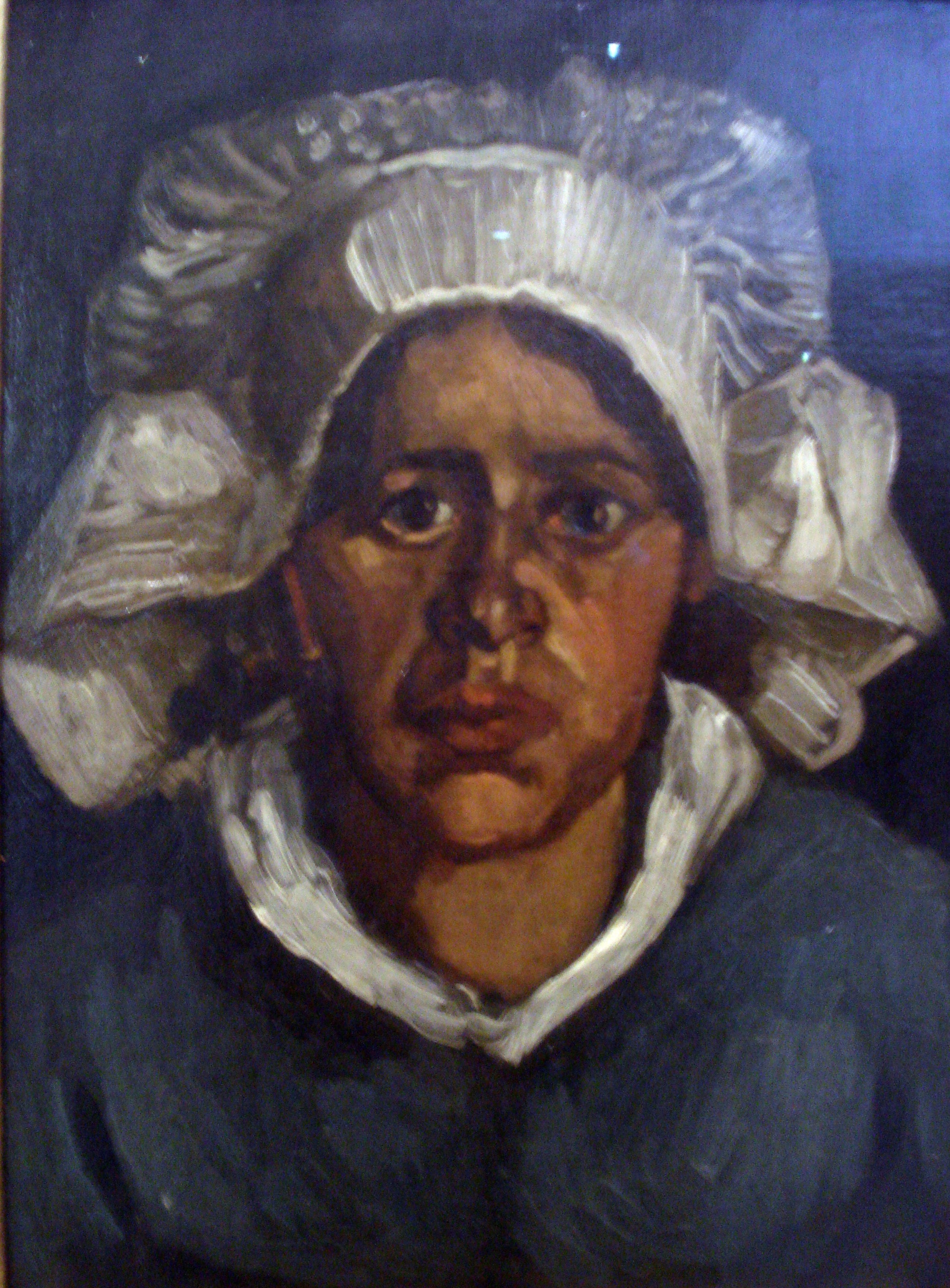 Bondhustruhuvud med vit mössa - Vincent van Gogh