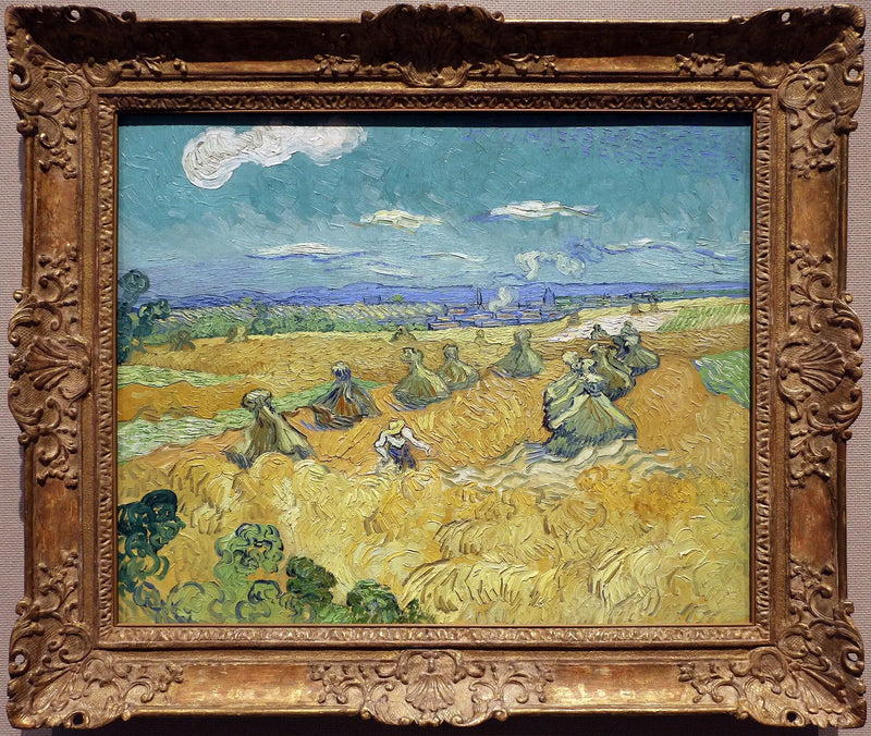 Vetefält med kärvar och skördetröska - Vincent van Gogh