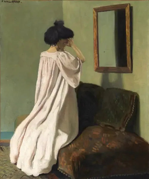 Gabrielle Vallotton knäböjande framför en spegel på divanen i ateljén på Rue des Belles-Feuilles - Félix Vallotton