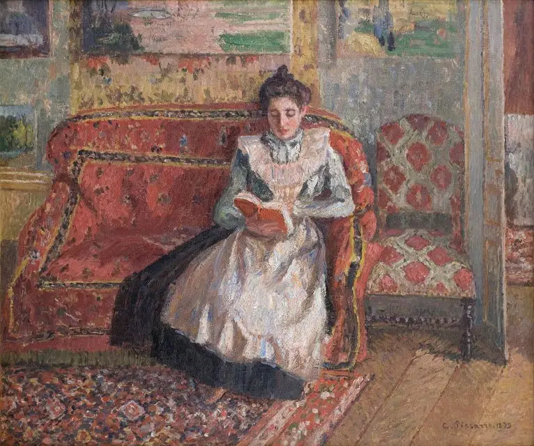 Jeanne Pissarro kallad Cocotte, läsande - Camille Pissarro