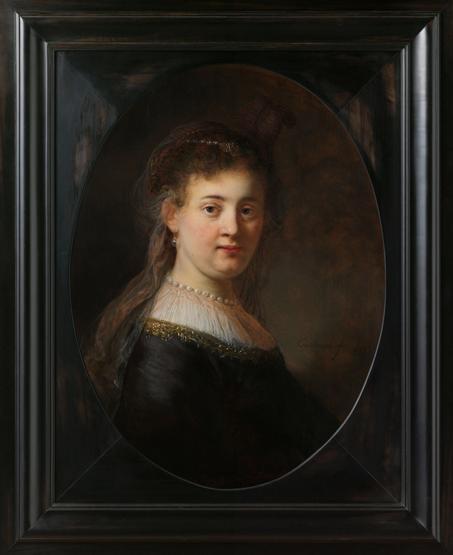 Jeune femme en vêtements fantaisie - Rembrandt