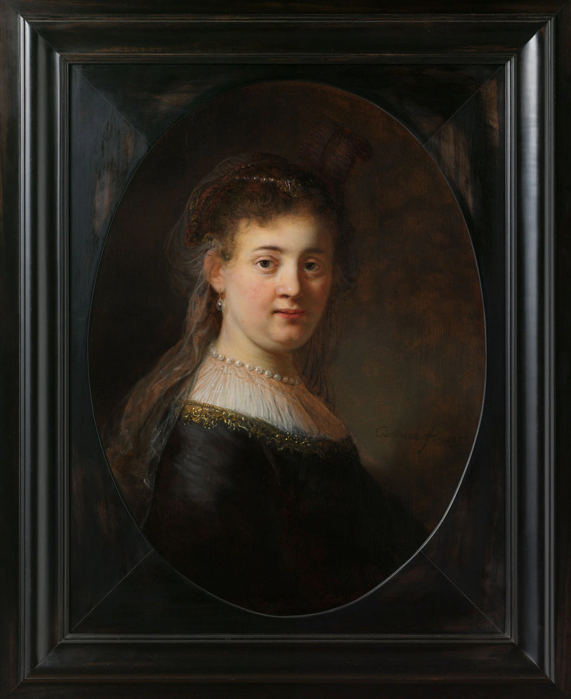 Jeune femme en vêtements fantaisie - Rembrandt