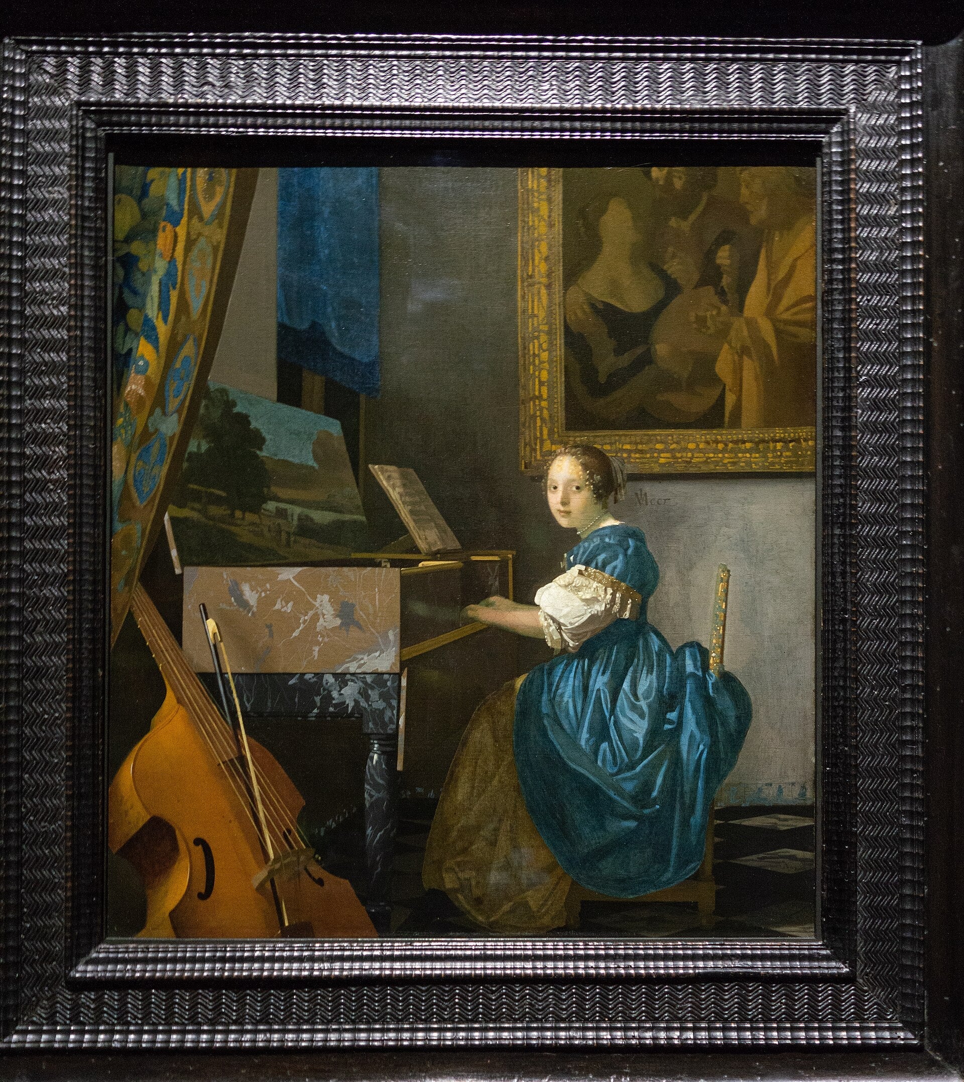 Ung kvinna som spelar på virginal - Johannes Vermeer