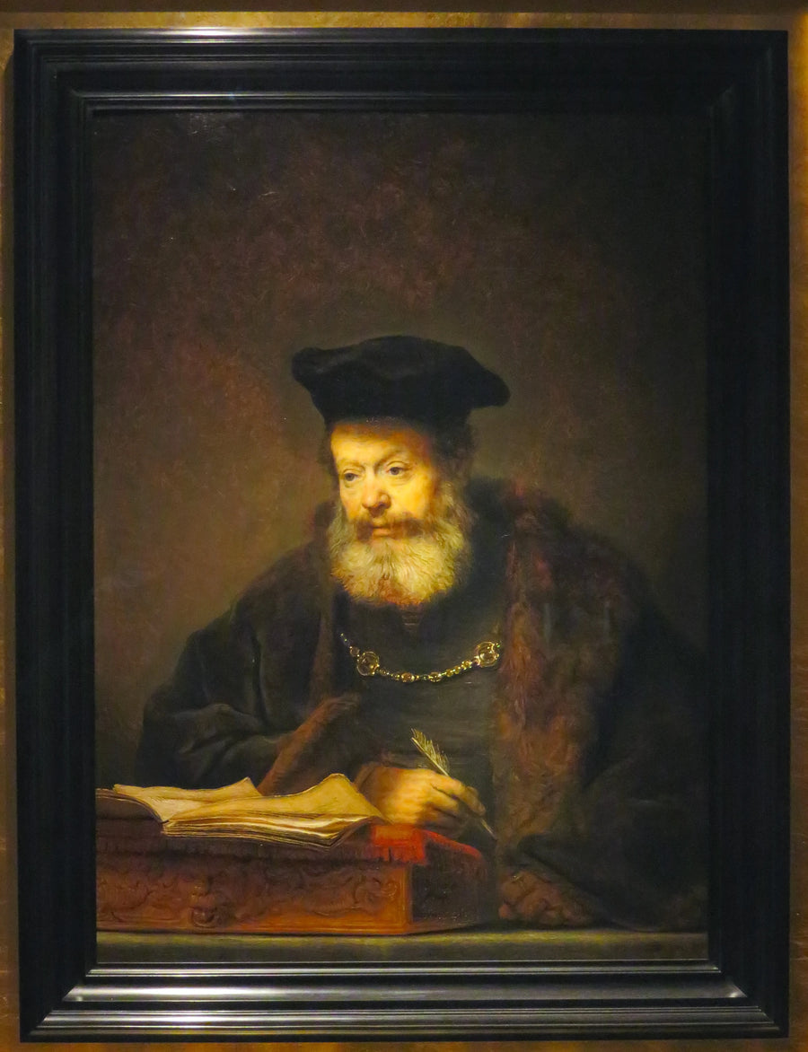 Lärd vid sitt arbetsbord - Rembrandt