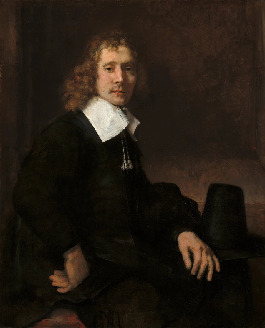 En ung man som sitter vid ett bord (kanske Govaert Flinck) - Rembrandt